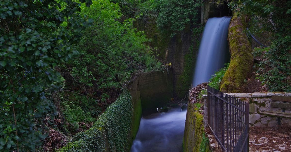 Waterfall flowing through a forest ravine in Agoriani (Eptalofos), Mount Parnassos, Greece